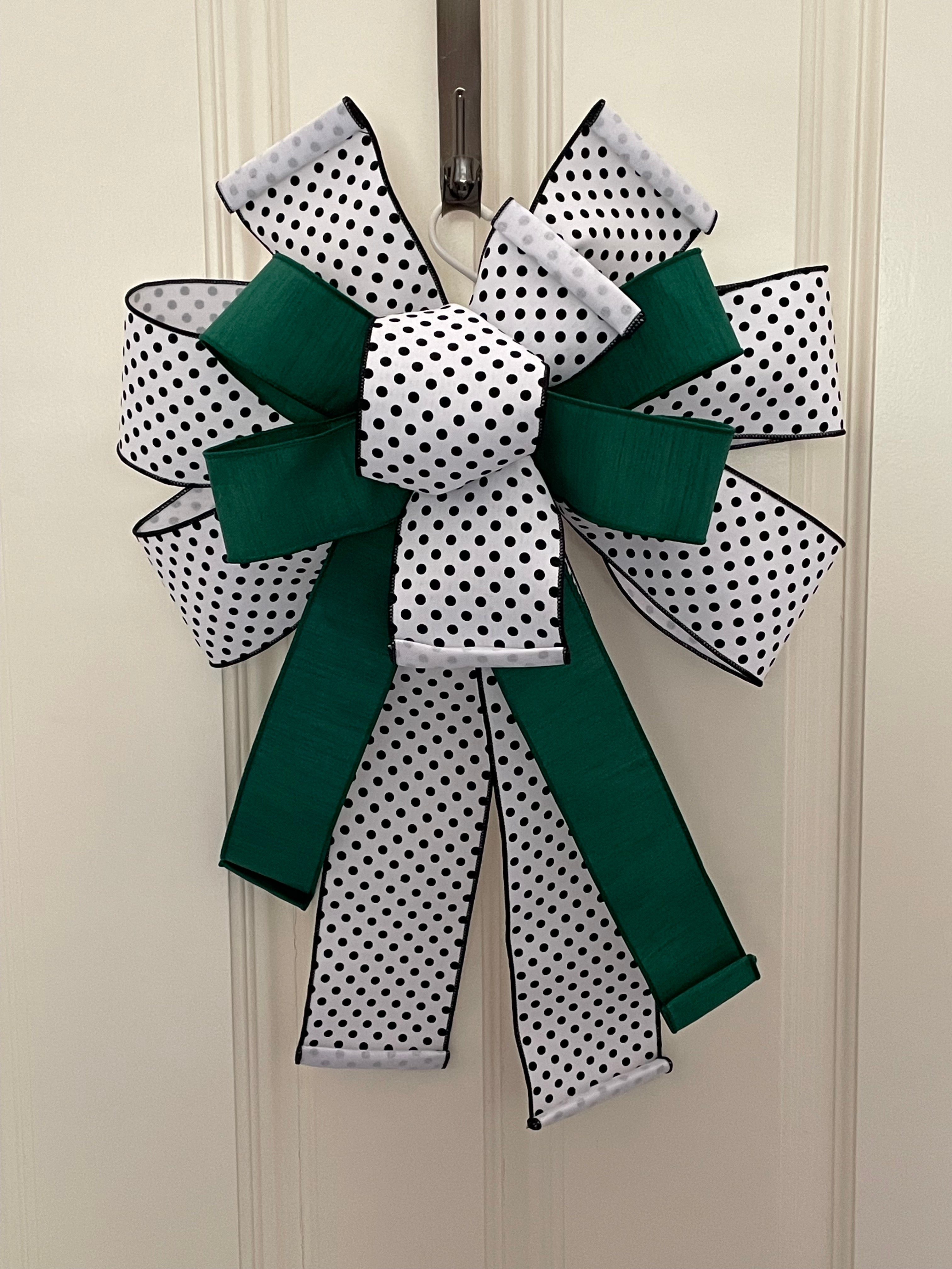 Large decorative bow for wreaths or door hangers comprised of a 4" Farrisilk white with black polka dot ribbon and a 2.5" Farrisilk emerald green dupion on a neutral background