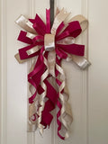 Large decorative bow for wreaths or door hangers comprised of a 2.5" Vickerman oat luster velvet ribbon, a 1" Farrisilk fuschia dupion ribbon, a 1" fuschia satin ribbon, and a 1" oat satin ribbon on a neutral background