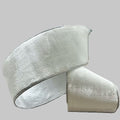 A roll of 4" winter white velvet ribbon with silver edging on a neutral background