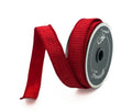 A roll of 1" pleated red metallic ribbon with the Farrisilk logo shown on the roll's flange on a neutral background